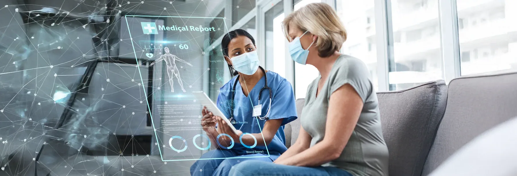 A doctor sitting with a patient.
