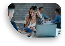 Business Woman smiling working on a laptop computer
